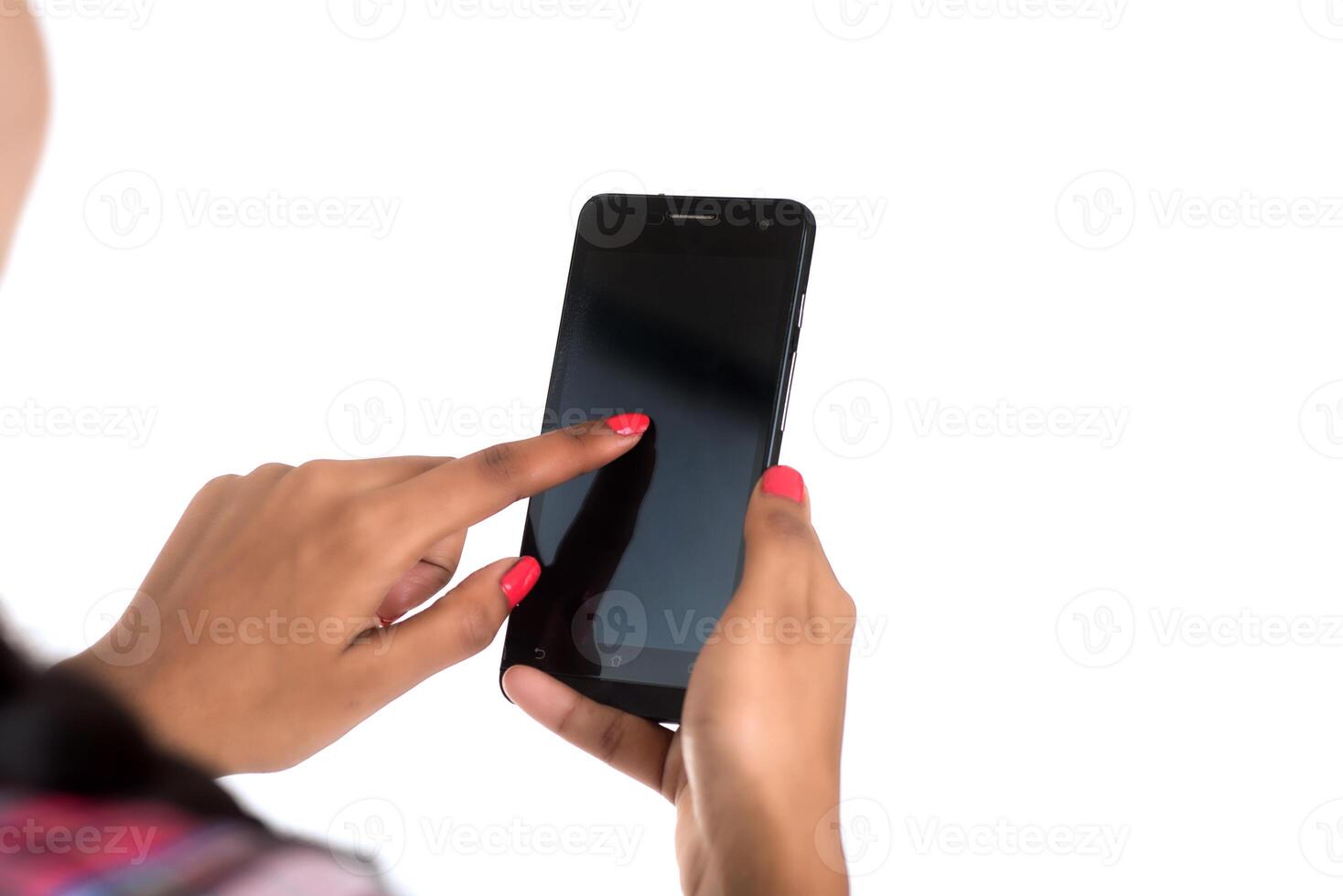 Young Indian girl using a mobile phone or smartphone isolated on a white background photo