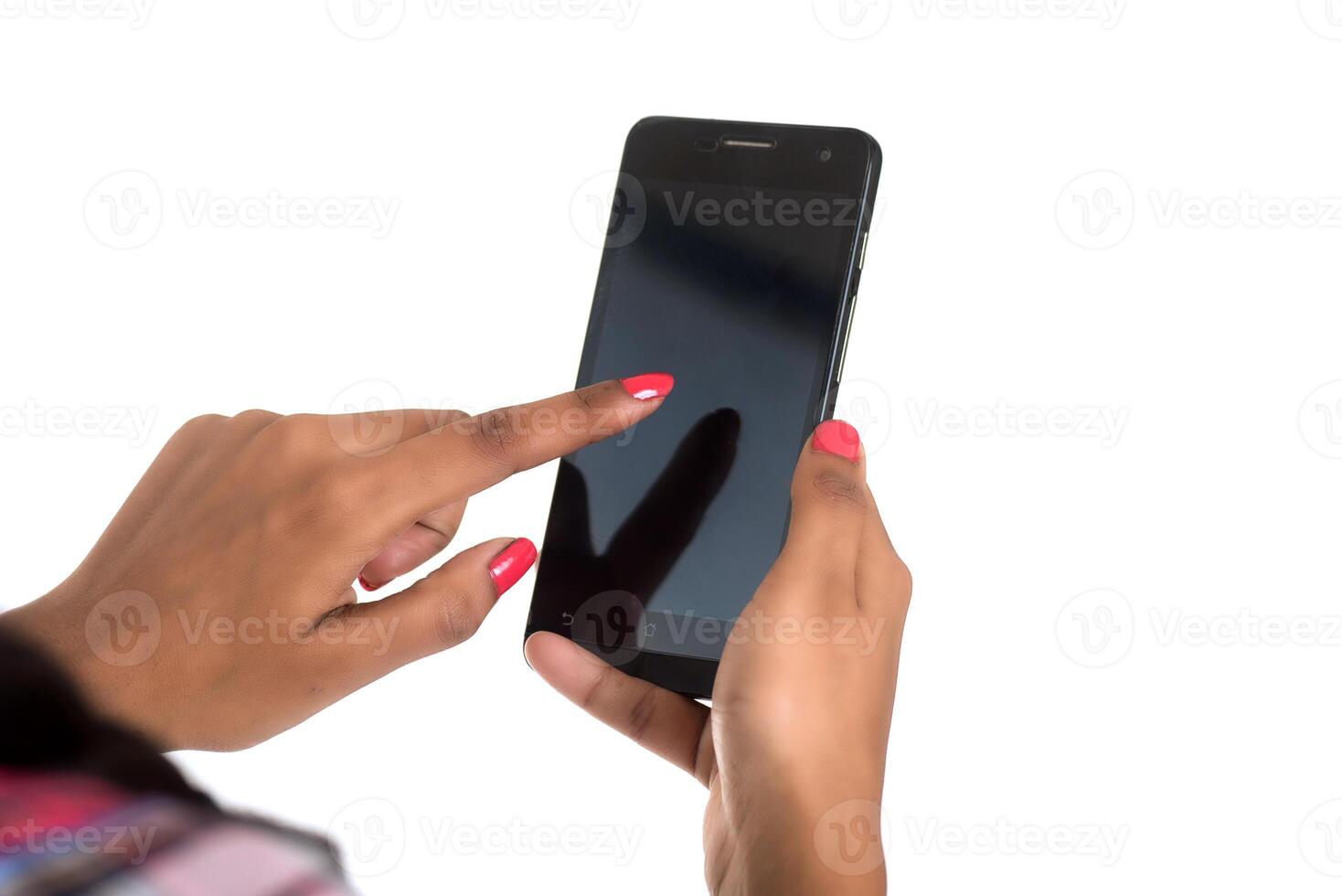 Young Indian girl using a mobile phone or smartphone isolated on a white background photo