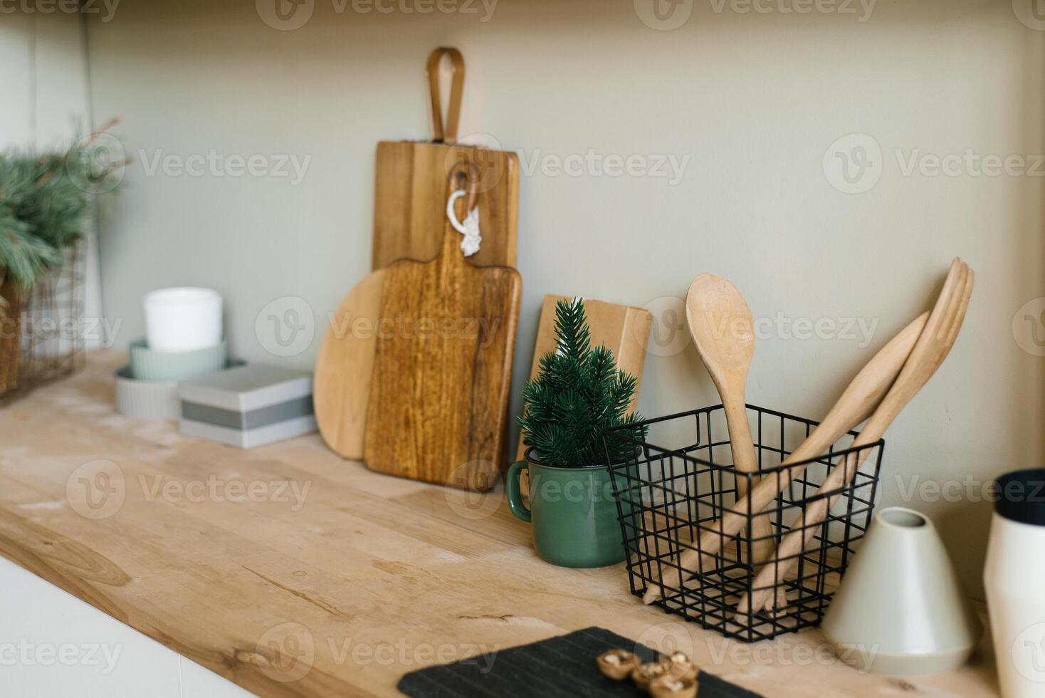 Scandinavian style kitchen utensils. Wooden cutting boards, wooden spoons and shovels. Christmas decor photo
