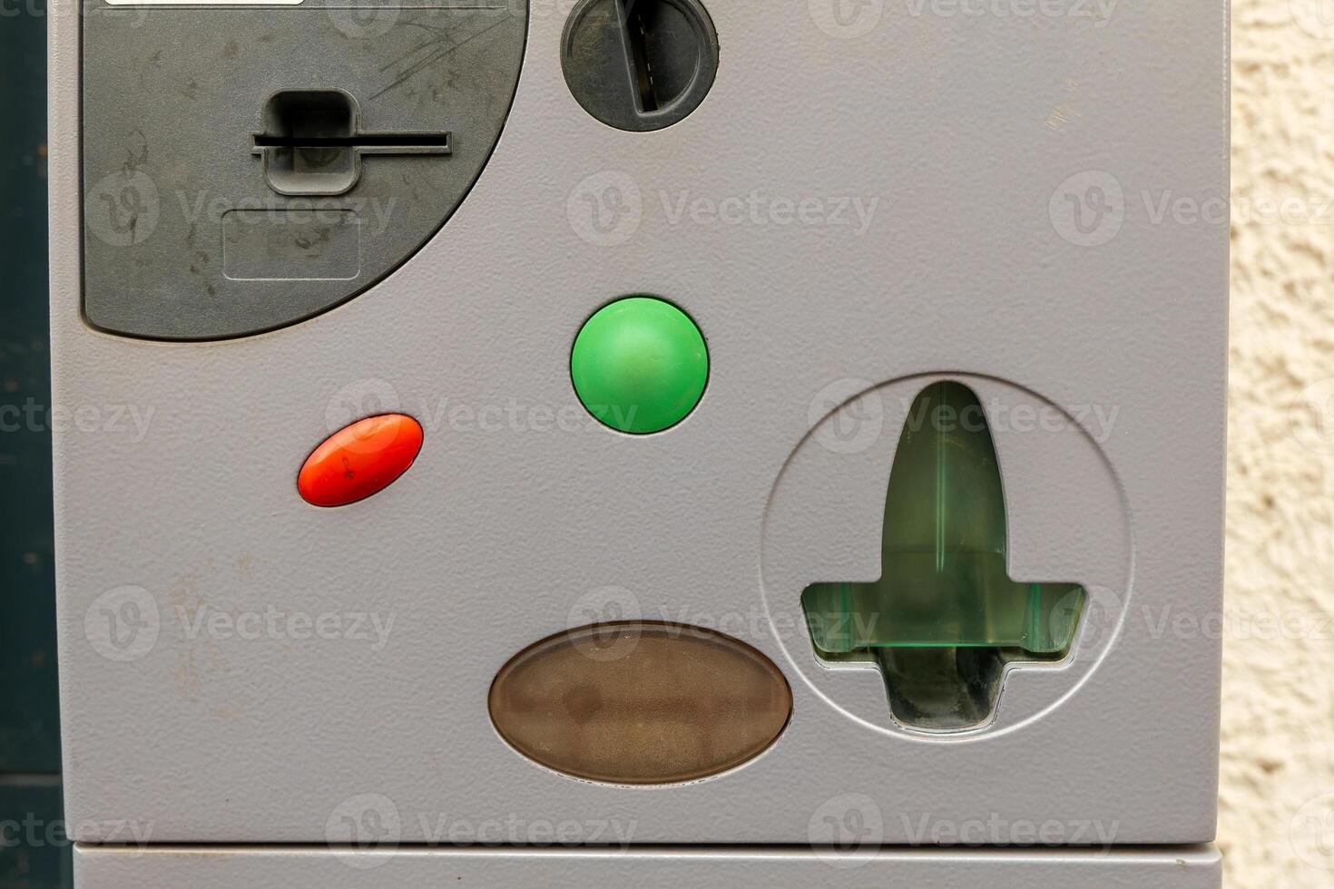 A close-up of a parking meter in a European city shows a green light indicating a successful payment photo