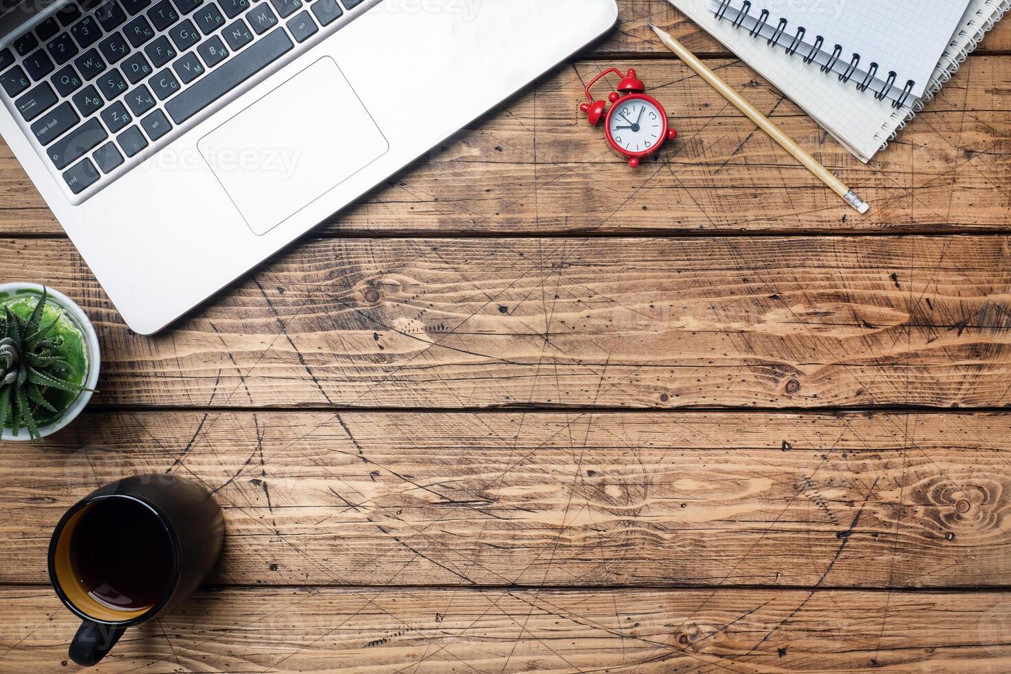 Working wooden table at home or in the office. Computer laptop coffee cactus. Flat lay conceptions Copy space. photo