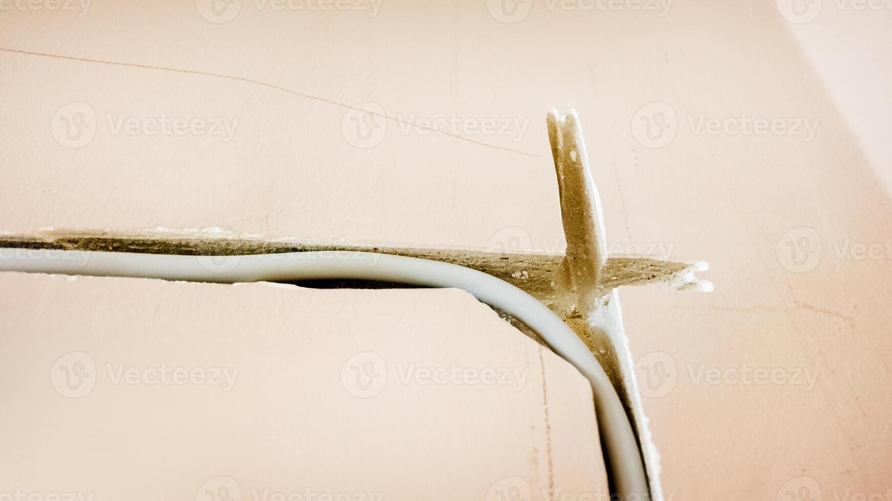 Cracked ceiling corner needing repair highlighting home maintenance issues photo