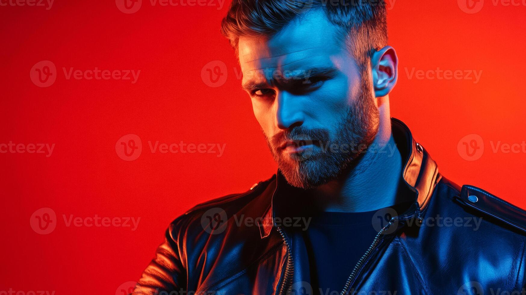 Dynamic portrait of a man in a biker jacket with dramatic backlighting shadows highlighting rugged facial features photo