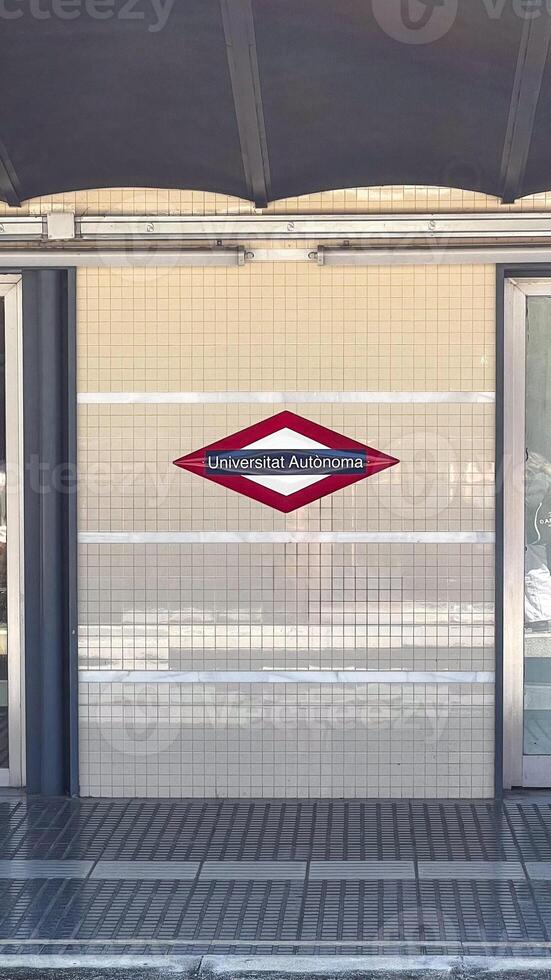 Exterior view of Universitat Autonoma metro station entrance symbolizes education and transport connectivity in Barcelonas urban setting photo