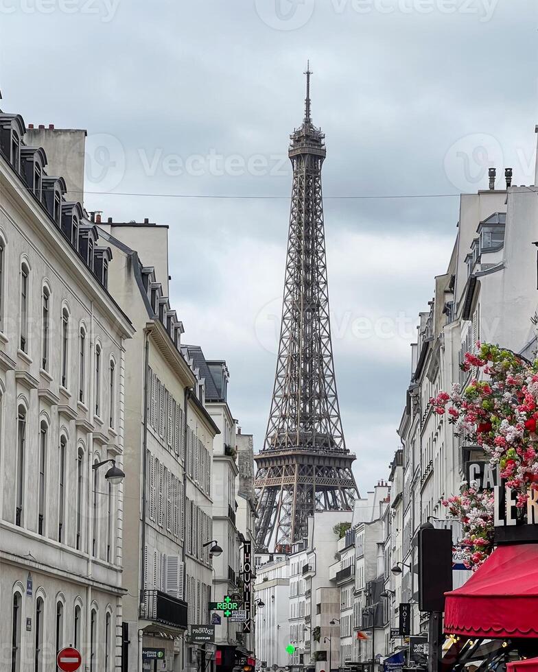 The Eiffel Tower rises above Parisian streets, capturing the essence of French architecture and tourism, ideal for Bastille Day themes photo