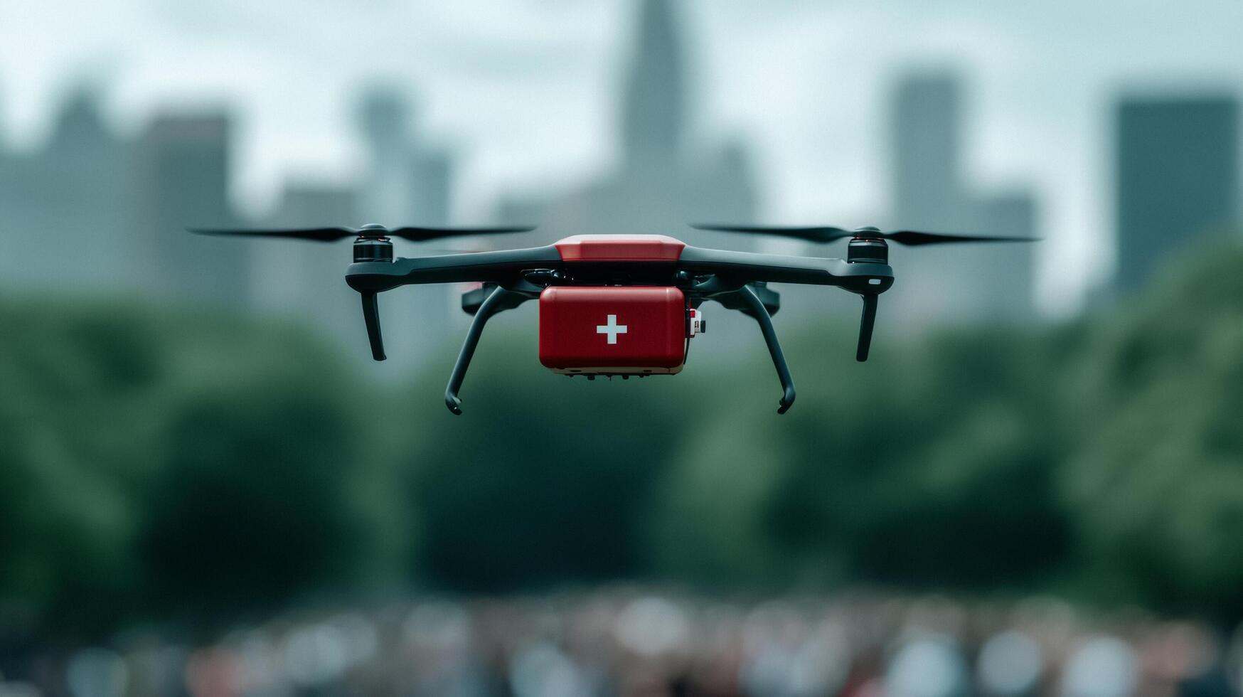 Emergency drone transporting a defibrillator across a crowded city park the red medical case visible under its chassis as it flies toward a distant crowd photo
