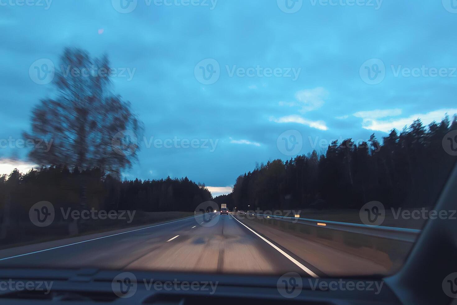 Blurred unfocused view through the moving car windscreen. Glitch retro effect. photo