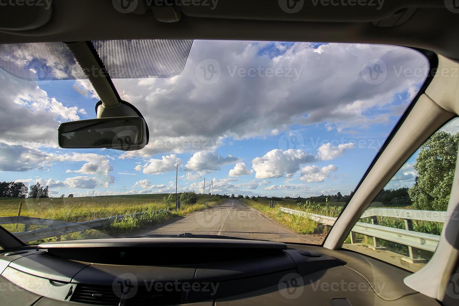 View of forest road through car glass. photo