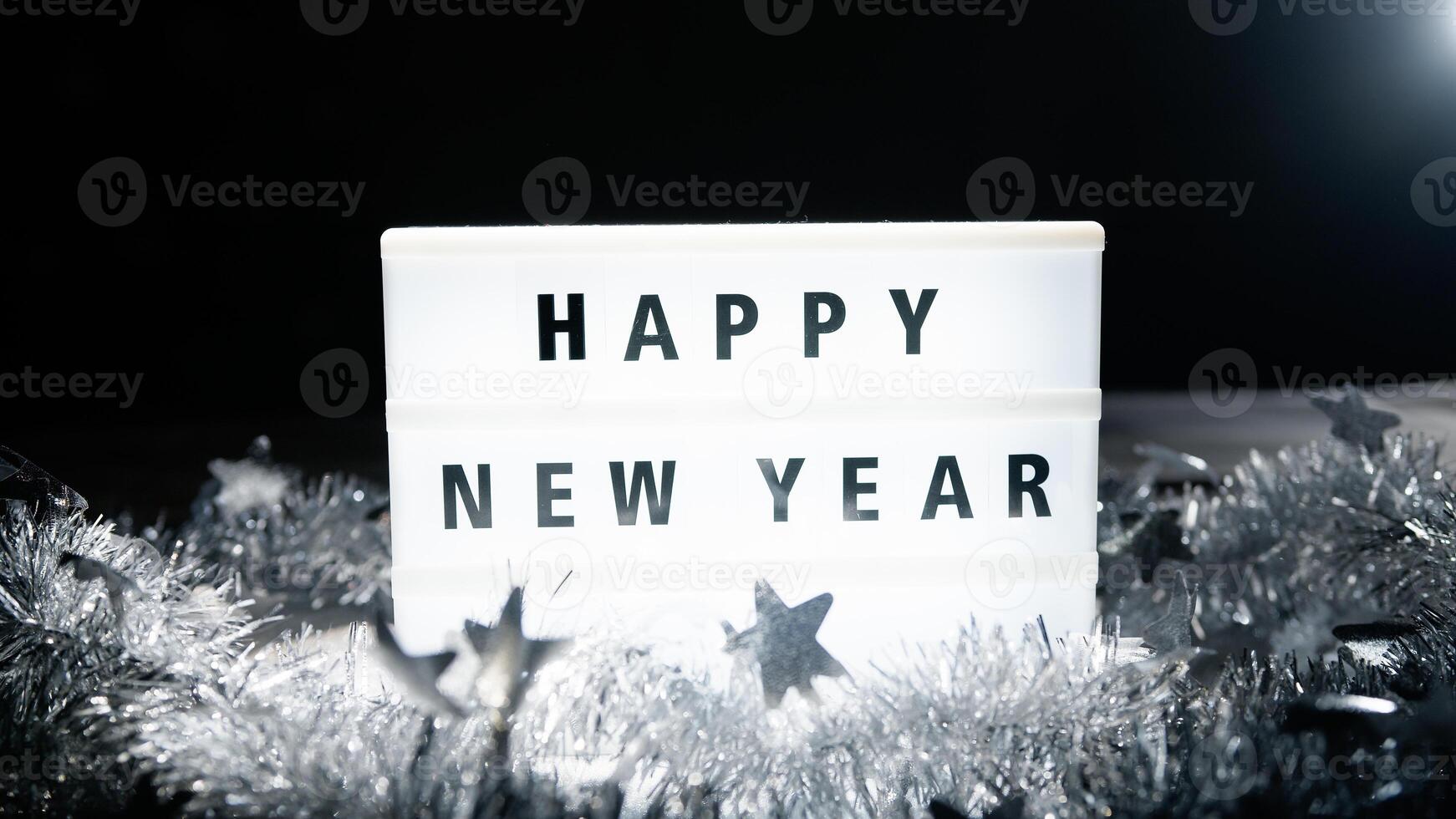 Light board with happy new year sign photo