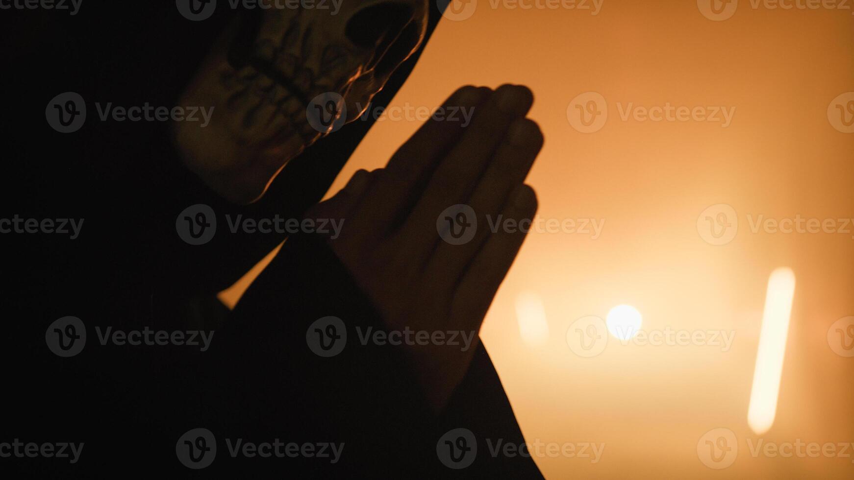 Silhouette Of The Death Skull Praying photo