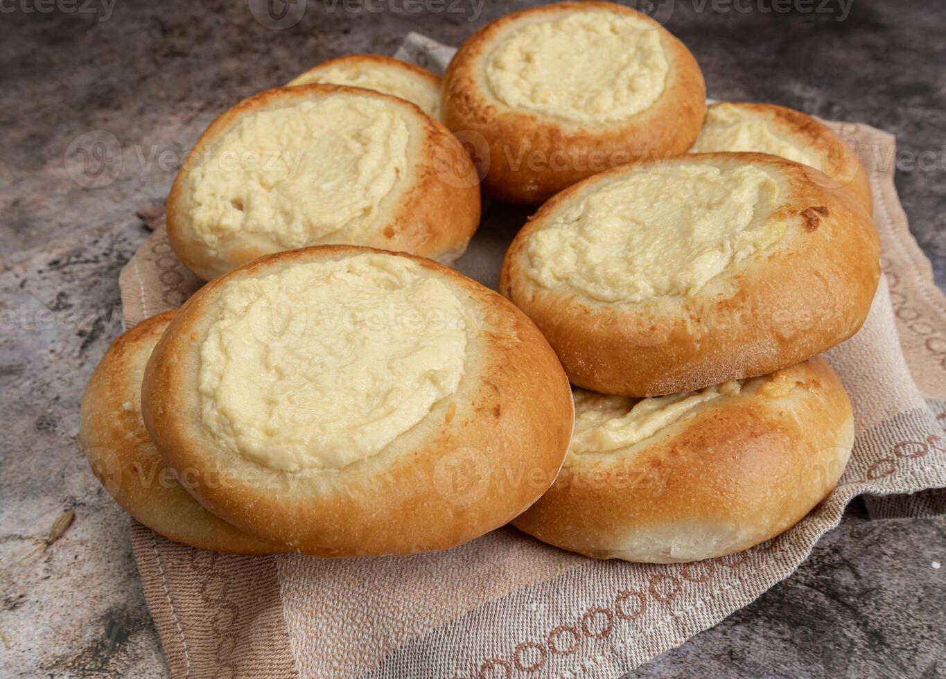 Vatrushka. ring of dough with quark in the middle. baking at home, Ball dough with cottage cheese photo