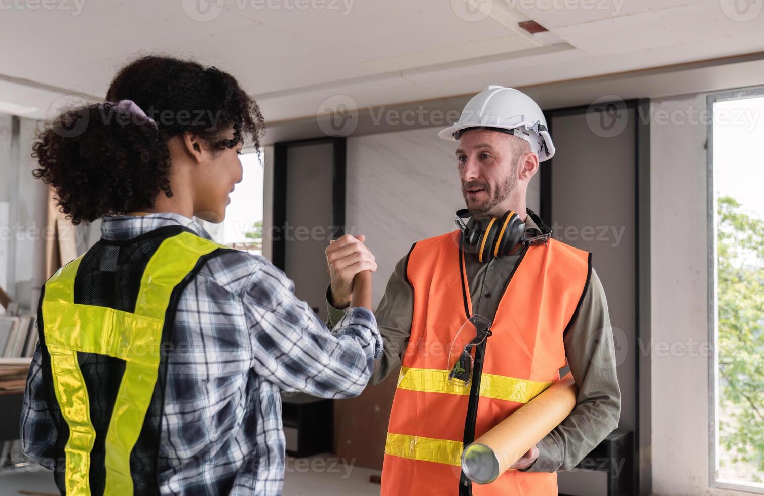 Engineering Team Celebrates Successful Project Completion with Handshake in Modern Office Environment photo