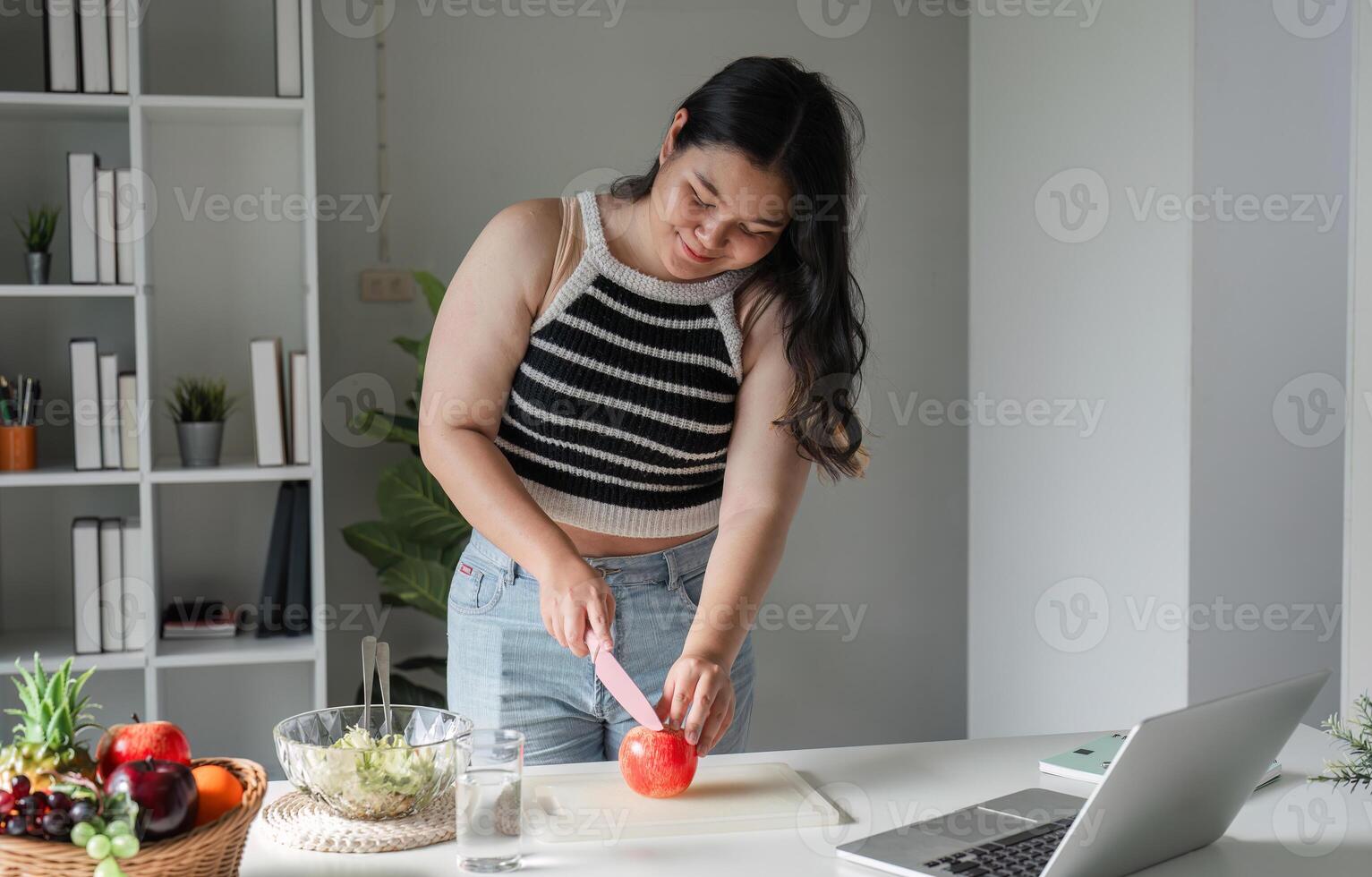 Young Woman Enjoying a Healthy Salad for Wellness and Nutrition in a Modern Home Setting photo