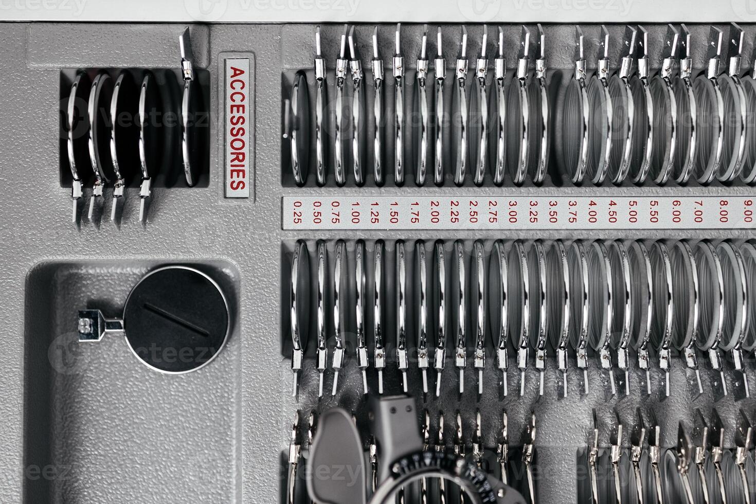 A vision measuring instrument with a trial frame used by optometrists for vision testing and eyewear selection. Concept of vision improvement, correction and restoration. Ophthalmologist instrument photo