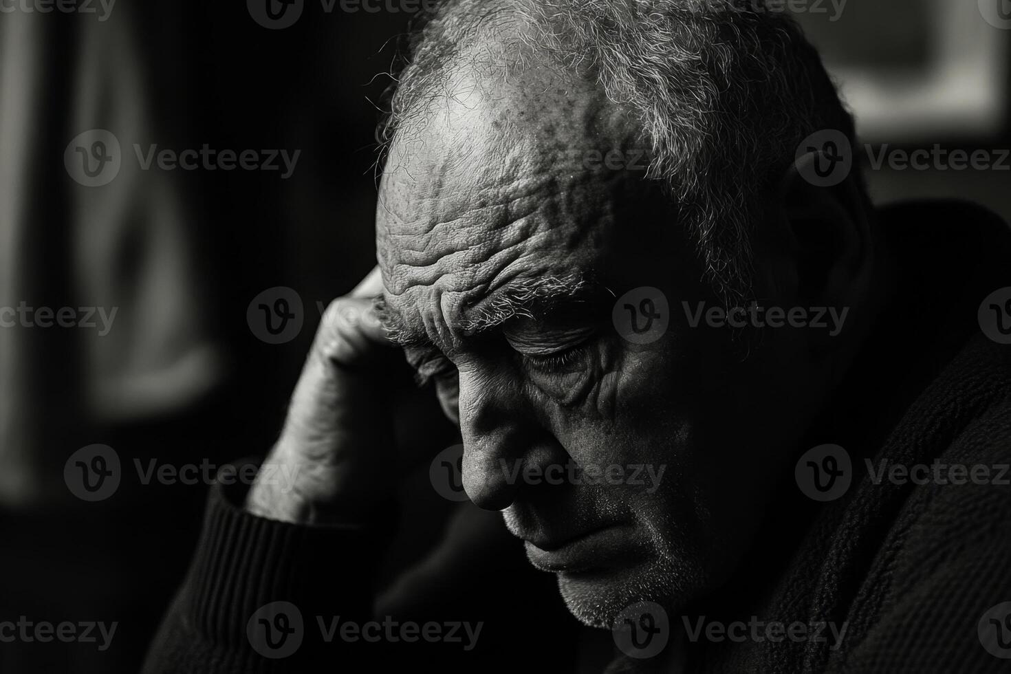 Senior man experiencing sadness and loneliness photo