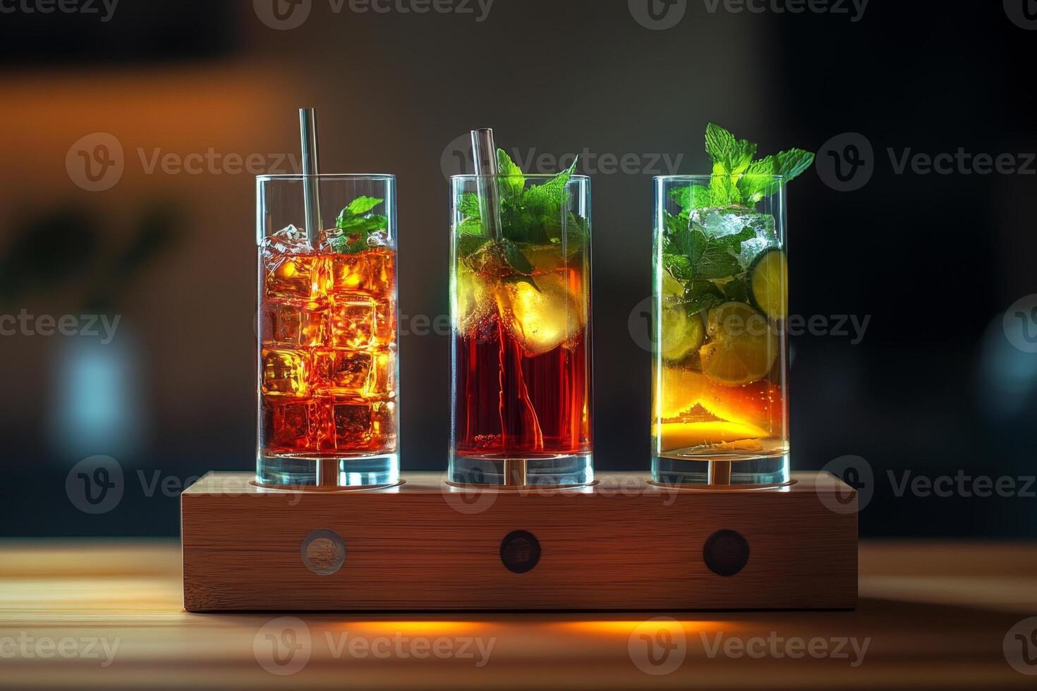 Three colorful cocktails standing on wooden desk are waiting for bartender photo