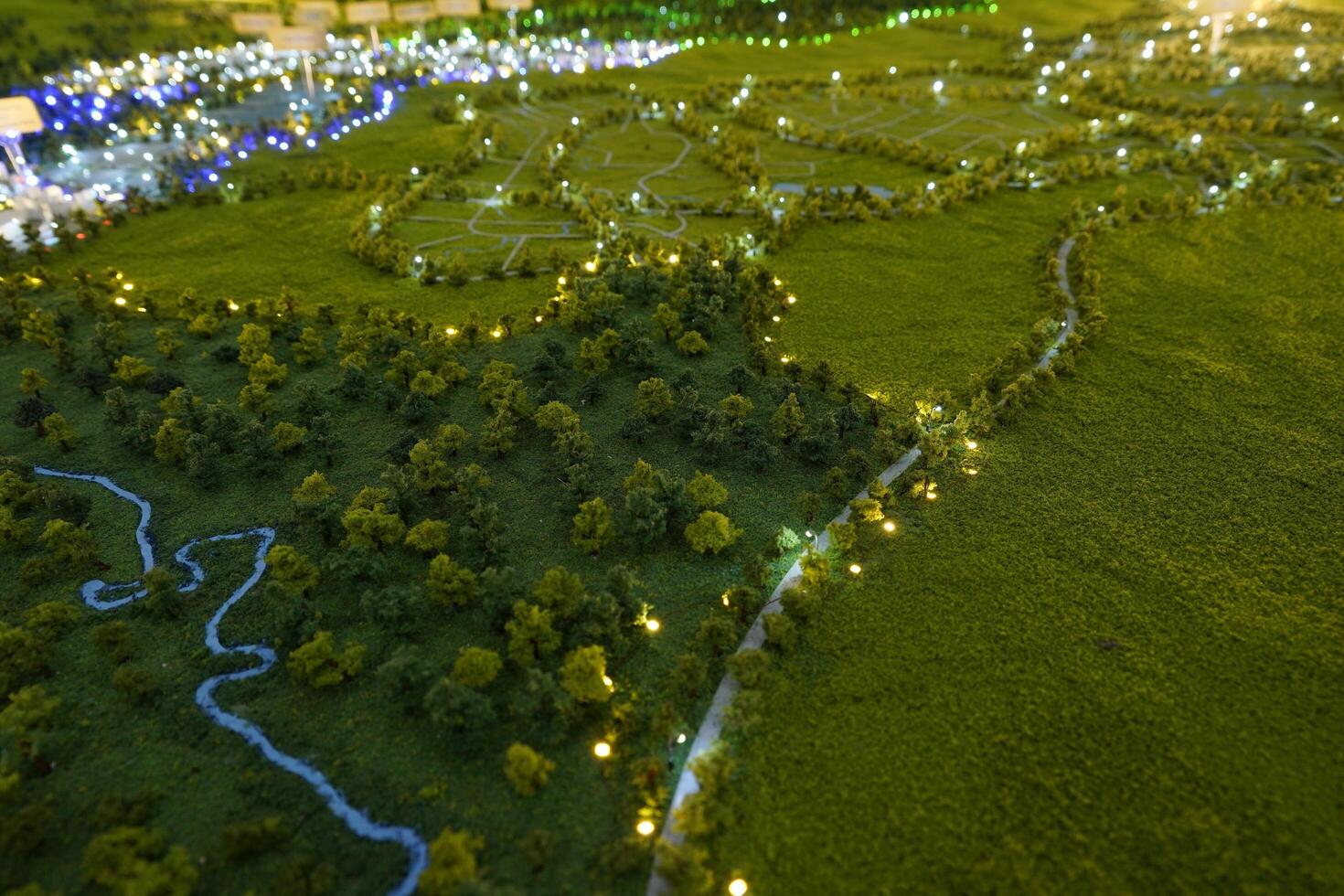 miniature of wide view of the land from above. In the center of the image, a winding river divides the landscape. photo