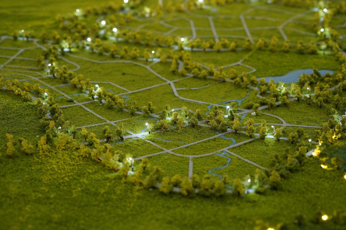 miniature of wide view of the land from above. In the center of the image, a winding river divides the landscape. photo