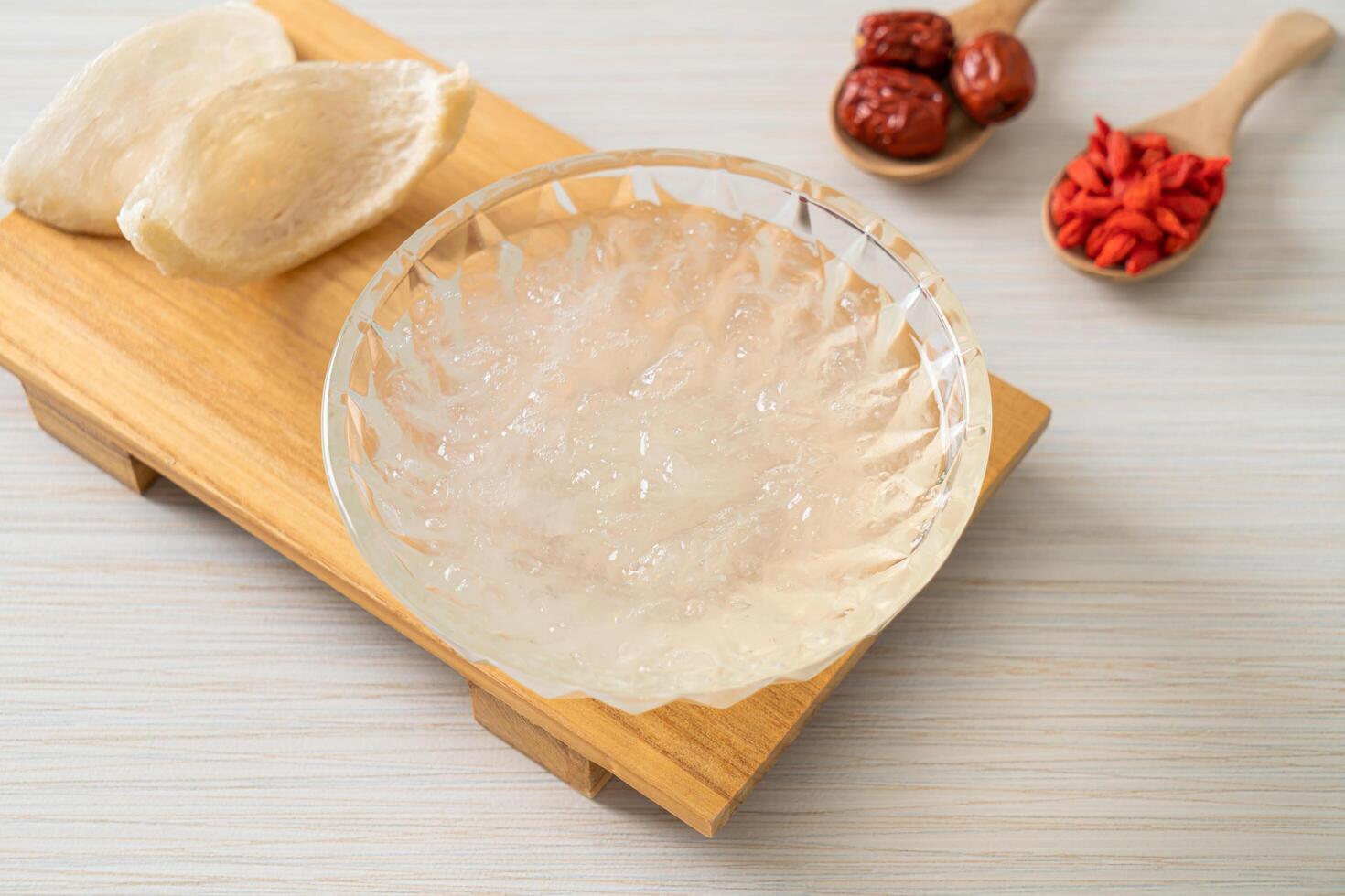 Edible bird's nest soup in glass bowl photo