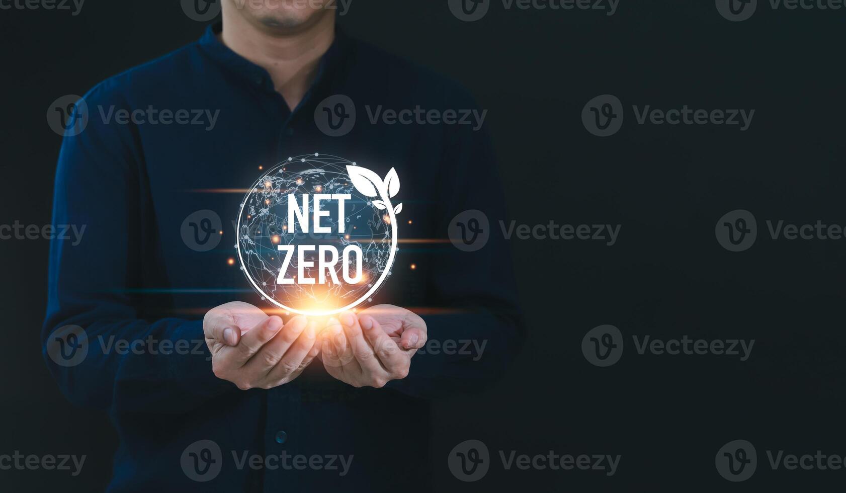 Businessman holding net zero icon with globe outline background for Net zero and carbon neutral concept. Net zero greenhouse gas emissions target. Climate neutral long term strategy. photo