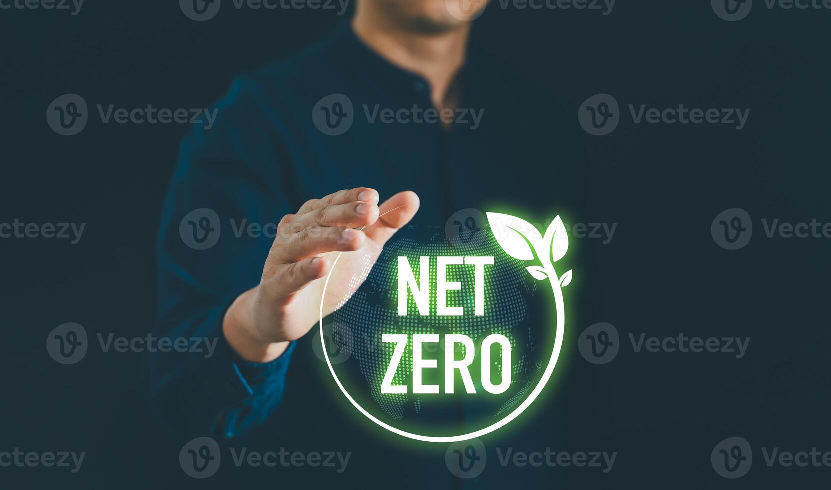 Businessman holding net zero icon with globe outline background for Net zero and carbon neutral concept. Net zero greenhouse gas emissions target. Climate neutral long term strategy. photo