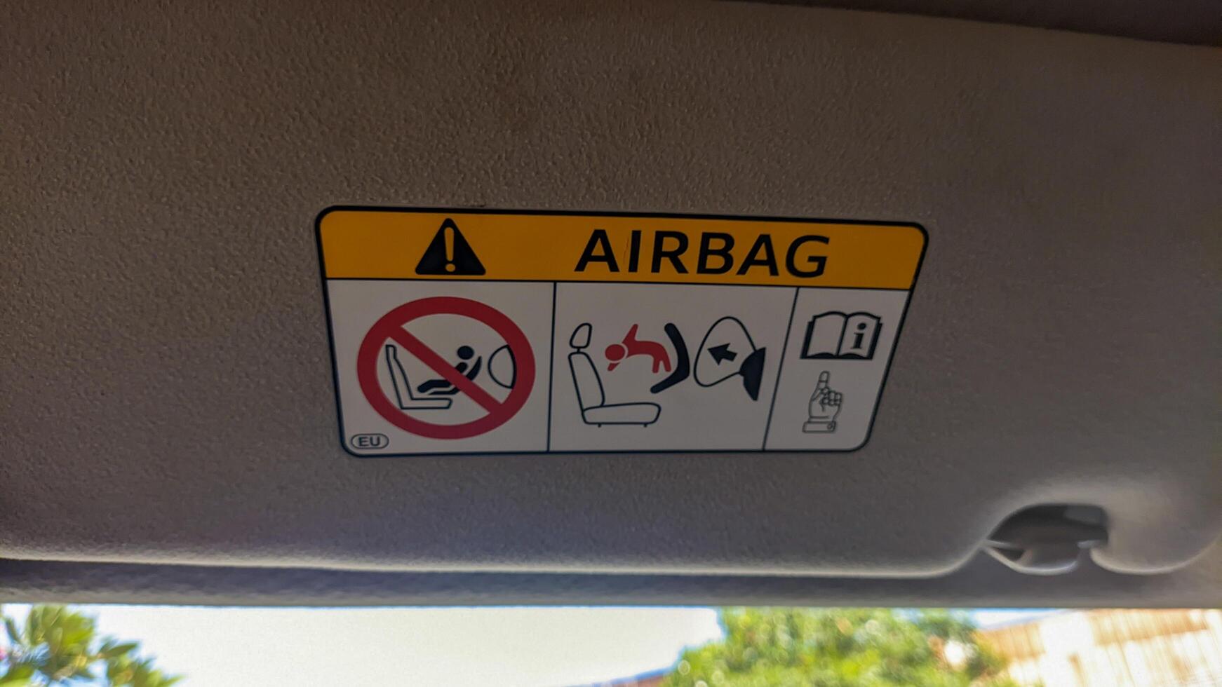 Airbag warning sign, built to reduce the impact of bumps in vehicles, helps to reduce serious injuries to adults or children. Surabaya, indonesia - may, 2023 photo