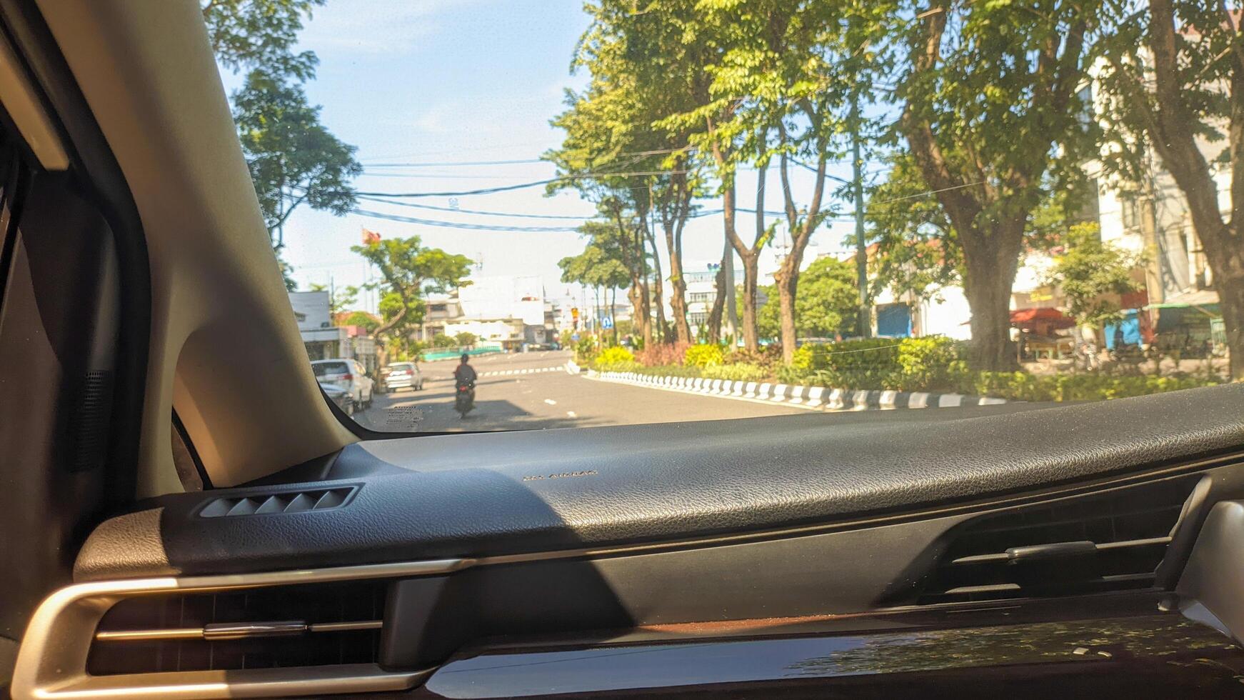 View of street from inside car photo