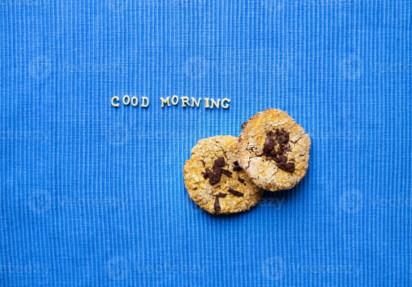 oatmeal cookies on a blue napkin that says good morning photo