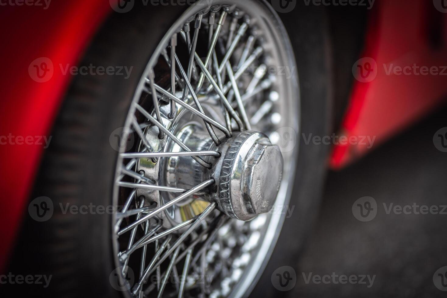 Wire wheel of a little classic British car, West Sussex, UK photo