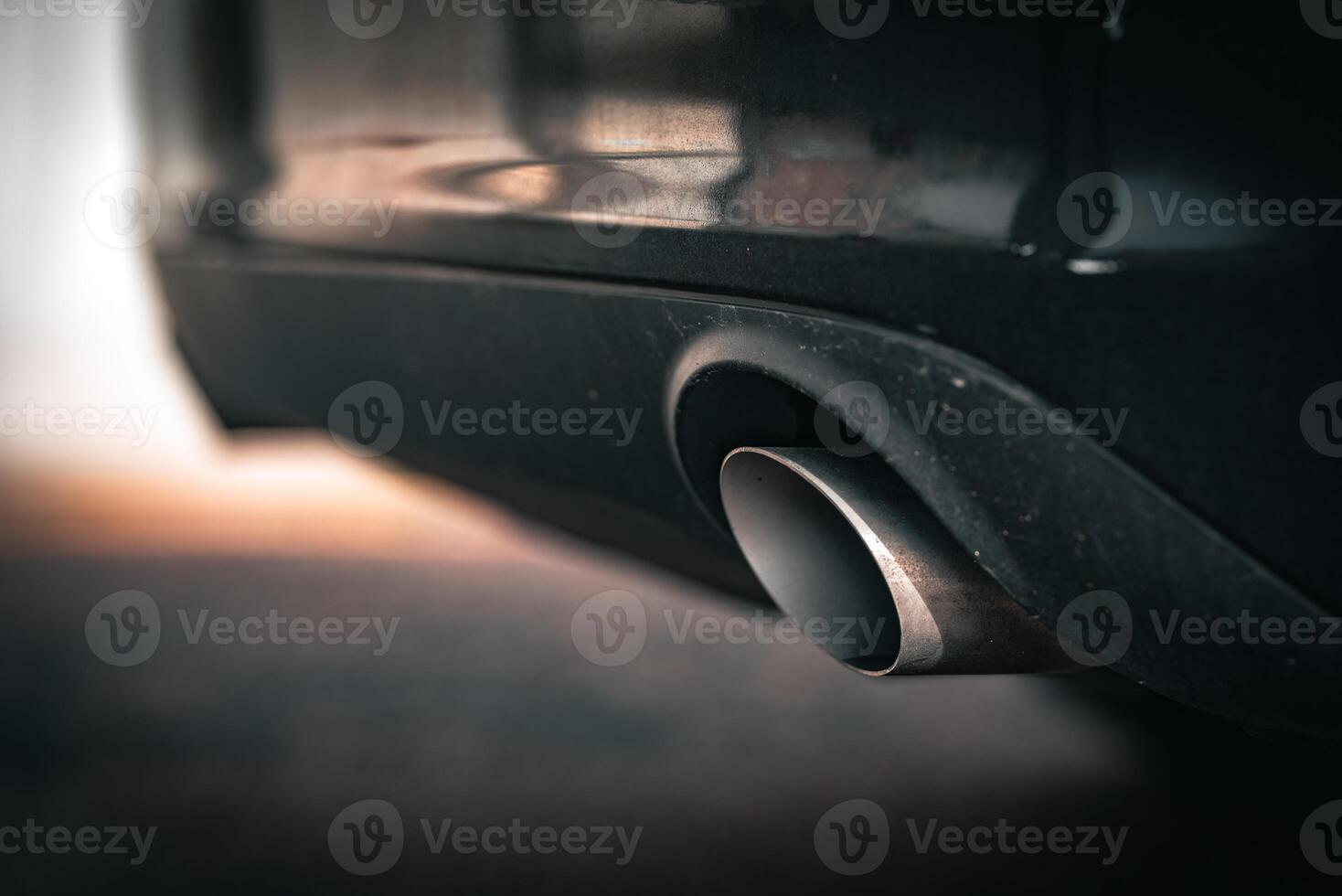 Close up exhaust pipes pipe of a modern car photo
