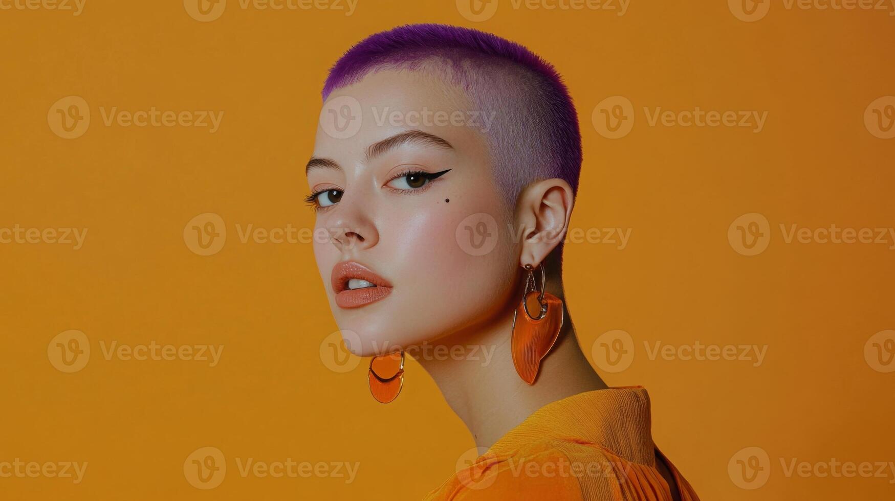 Model with purple buzzcut, quirky expression, wearing bold earrings, posed against a vibrant background photo