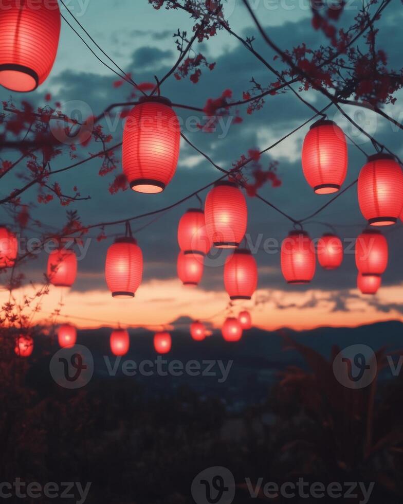 A display of red lanterns glowing at sunset, suspended in the air, creating a serene and festive scene. photo