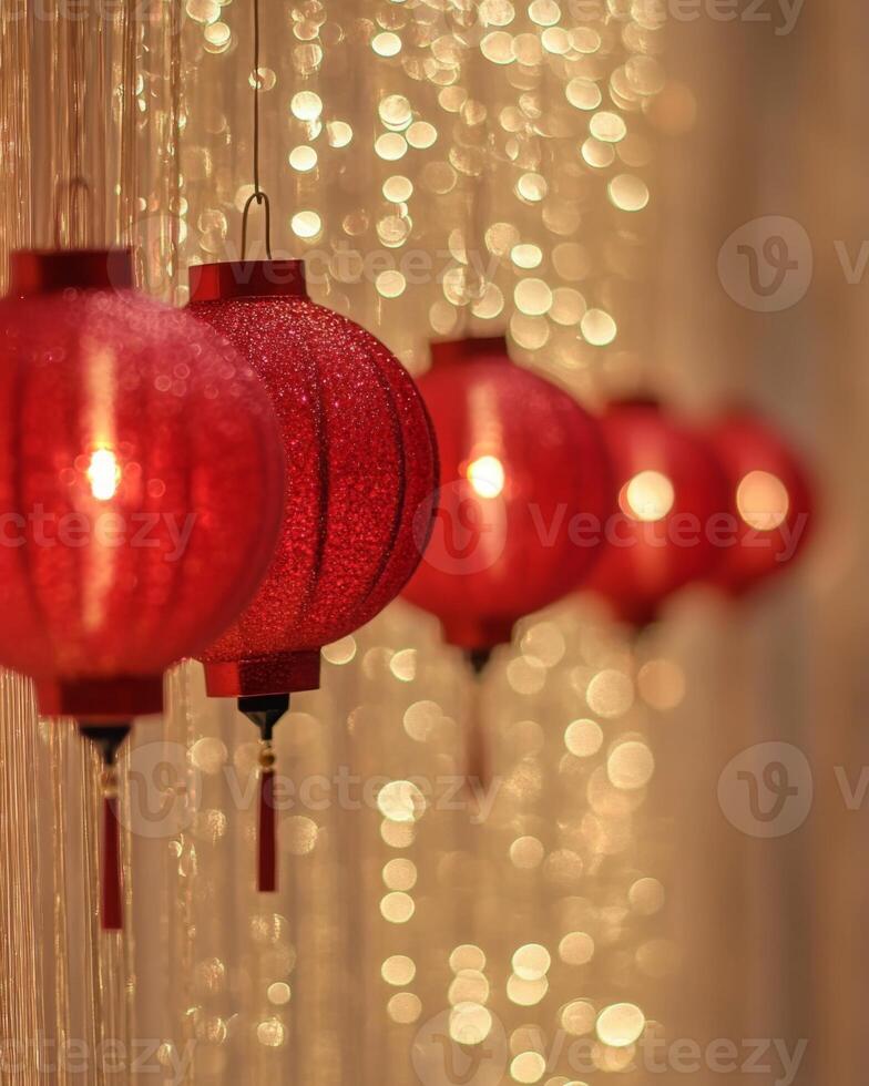 A row of glowing red lanterns hanging in soft lighting, with golden sparkles in the blurred background, creating a warm festive tone. photo
