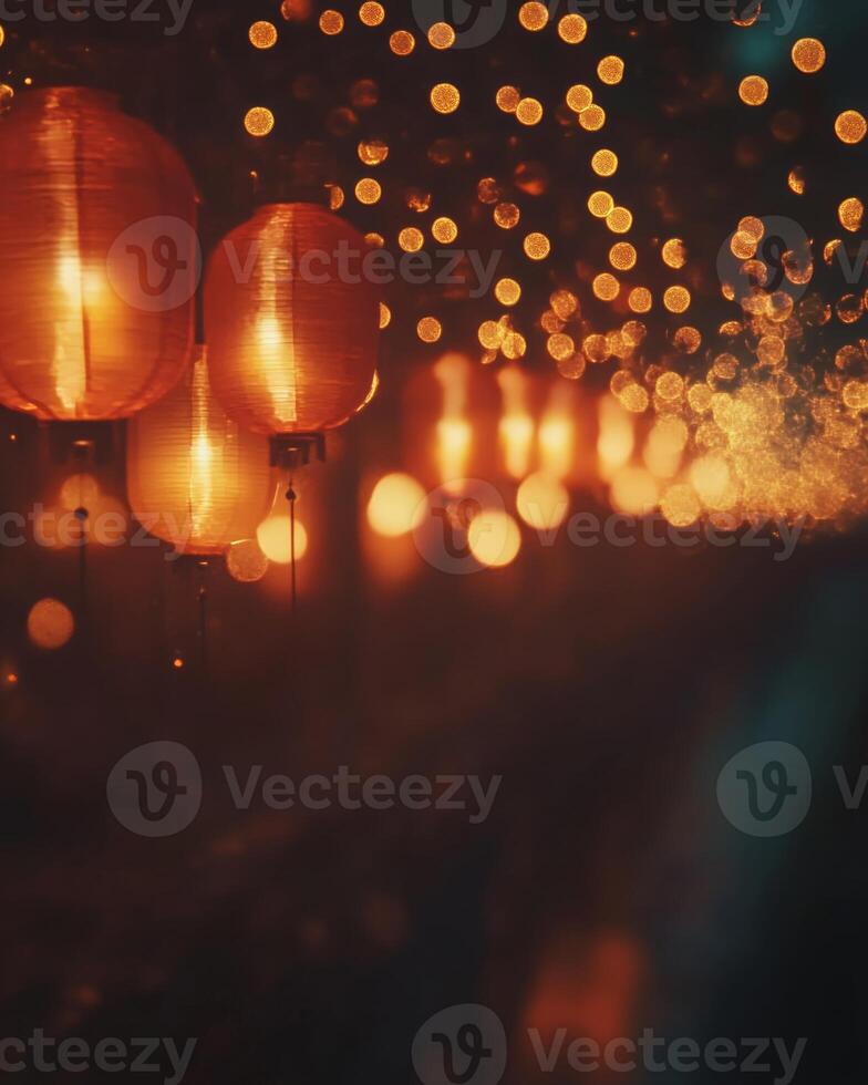 Traditional red lanterns softly glowing, strung along a street during a night festival, with blurred golden lights creating a festive feel photo