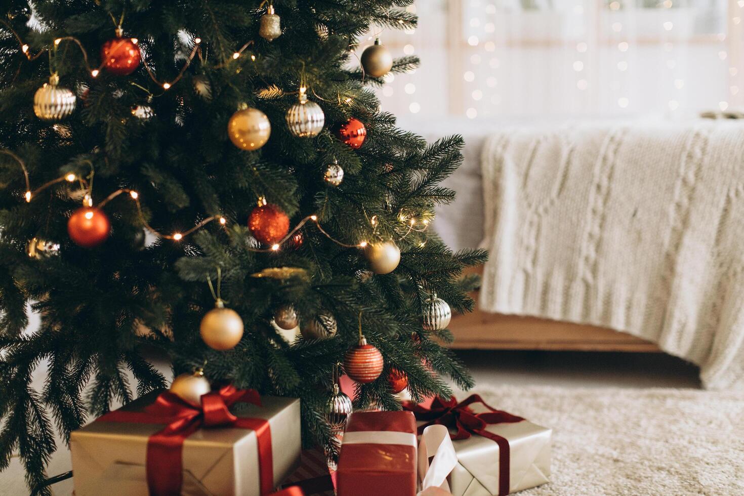 Christmas tree background. Closeup still of spurs with handmade decor. New year interior photo