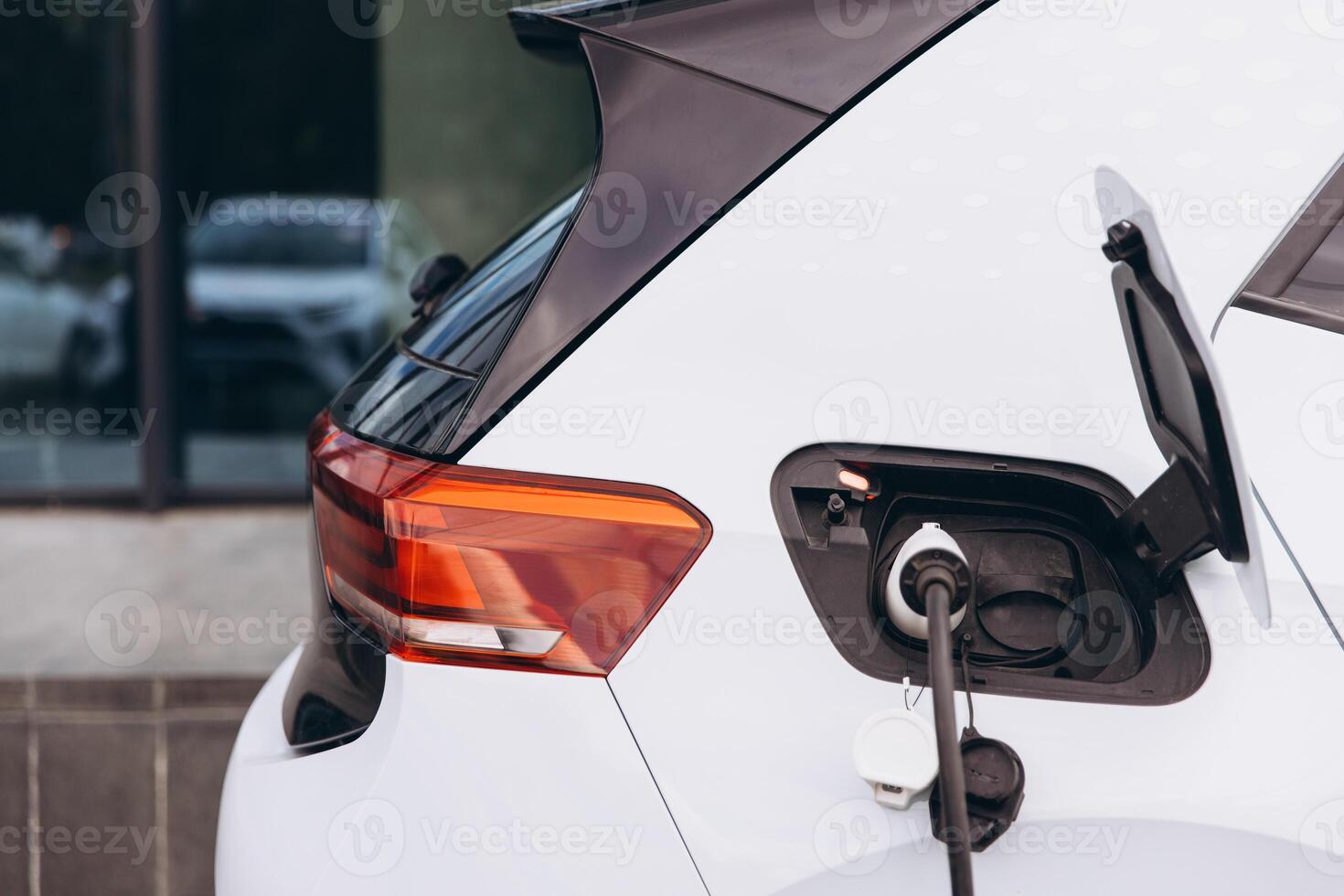 Close-Up of Electric Car Charging at a Station photo