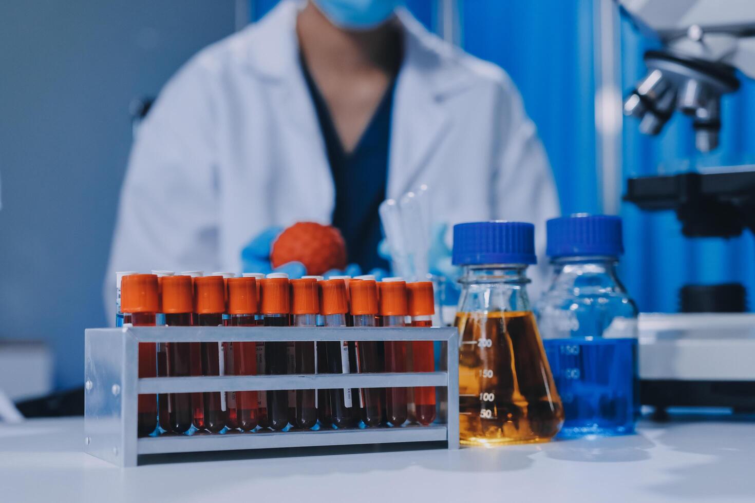 Scientist using microscope in laboratory. Close-up of a researcher's hands adjusting a modern microscope in a lab setting. Science concept photo