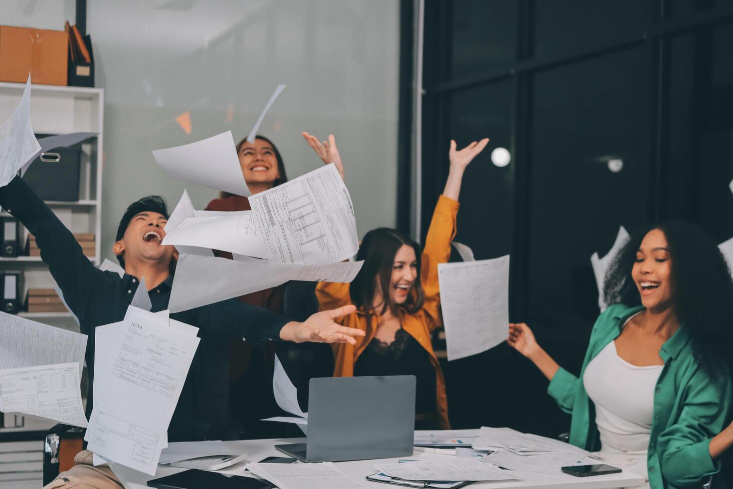 Motivated funny diverse business team people dancing celebrating success at corporate party on friday, happy friendly multiracial coworkers group having fun together enjoy victory dance in office photo