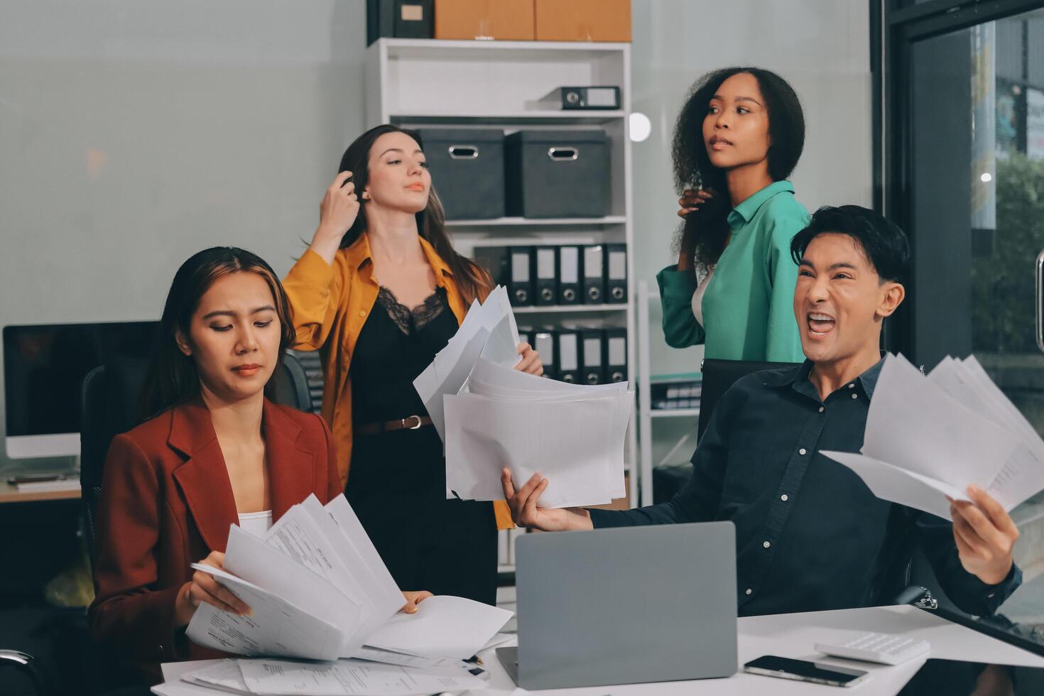 Stress, business people and employee frustrated with multitasking, pressure or overworked by team in chaos with paperwork. Anxiety, headache and worker overwhelmed by group and burnout in crisis photo