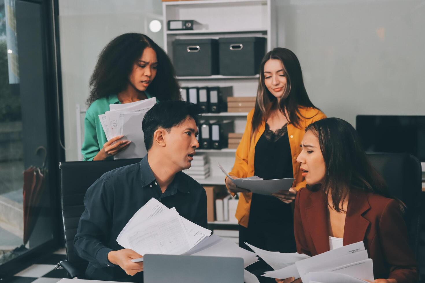 Stress, business people and employee frustrated with multitasking, pressure or overworked by team in chaos with paperwork. Anxiety, headache and worker overwhelmed by group and burnout in crisis photo
