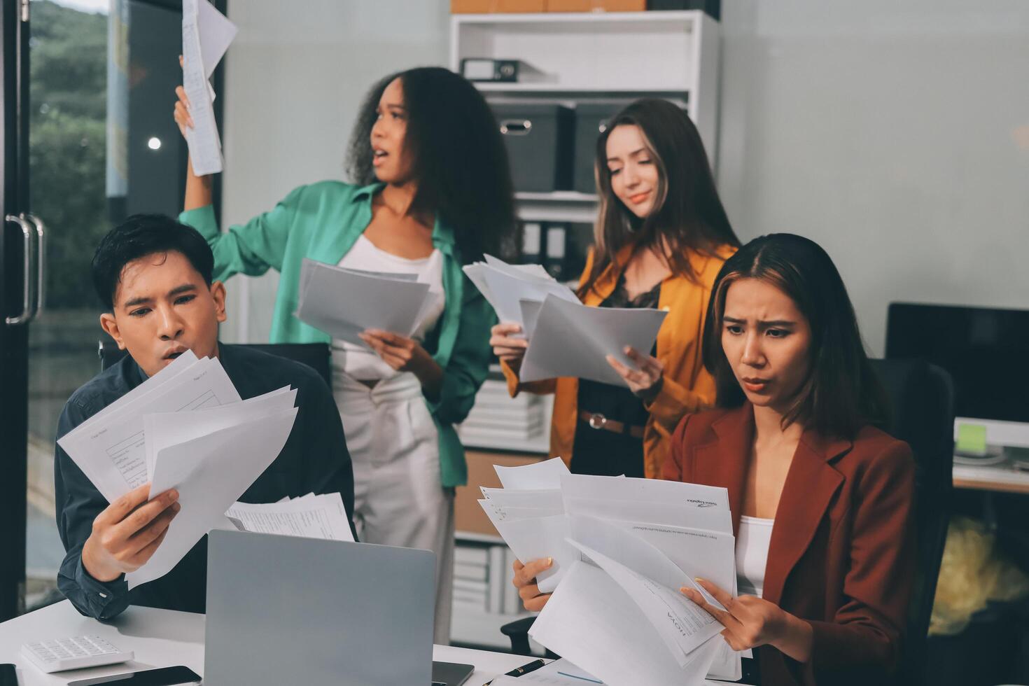 Stress, business people and employee frustrated with multitasking, pressure or overworked by team in chaos with paperwork. Anxiety, headache and worker overwhelmed by group and burnout in crisis photo