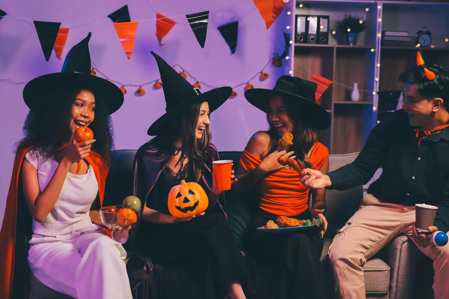 Joyful office Halloween party with coworkers in costumes, celebrating with drinks and laughter, fostering teamwork and festive spirit photo