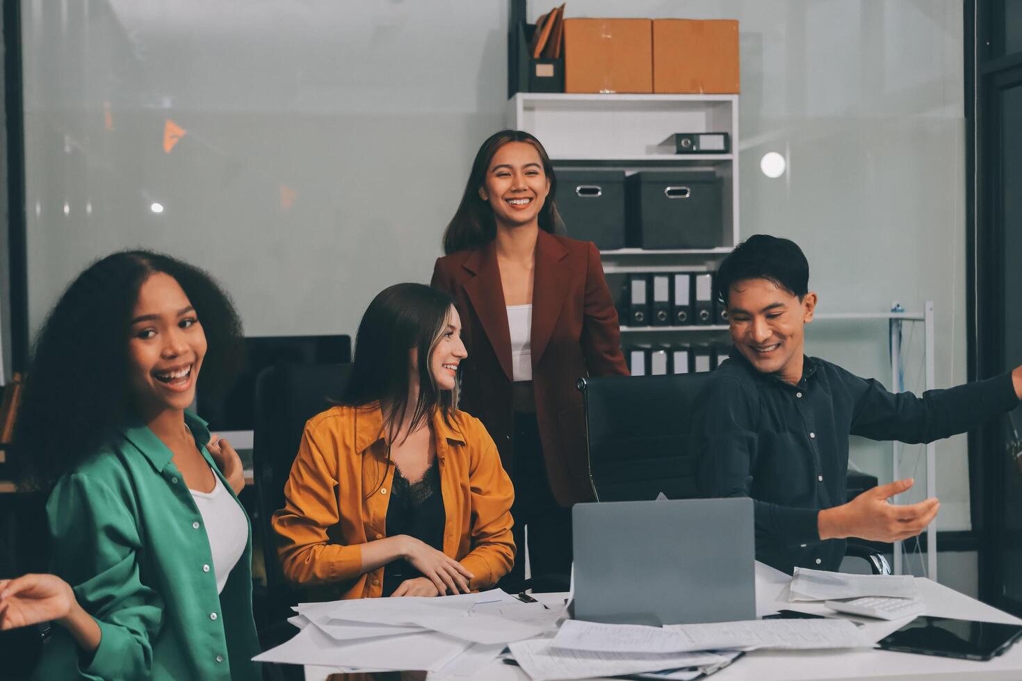 Motivated funny diverse business team people dancing celebrating success at corporate party on friday, happy friendly multiracial coworkers group having fun together enjoy victory dance in office photo