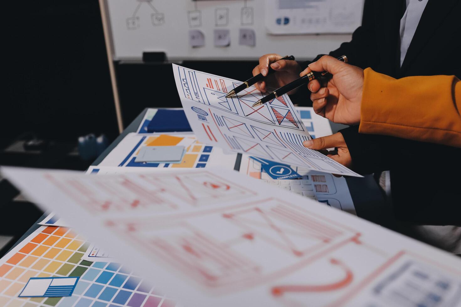 The designer team is designing the uxui system to make the uxui system work well on new phones and support system updates. Website development concept UI UX front end designer photo