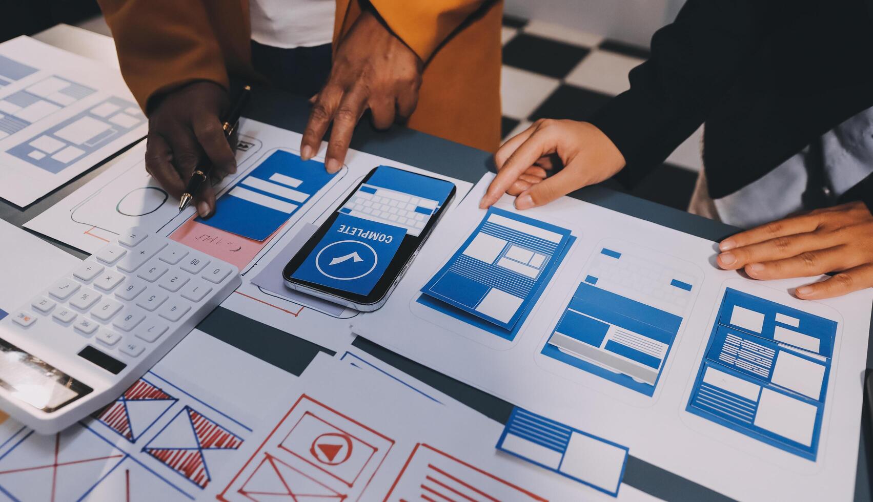 The designer team is designing the uxui system to make the uxui system work well on new phones and support system updates. Website development concept UI UX front end designer photo