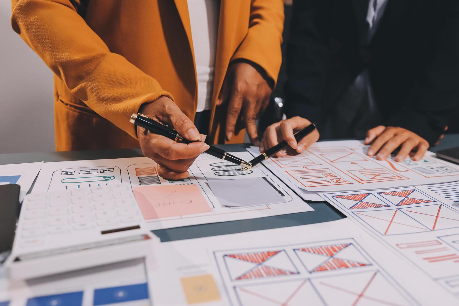 The designer team is designing the uxui system to make the uxui system work well on new phones and support system updates. Website development concept UI UX front end designer photo