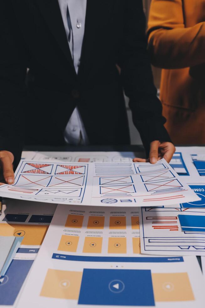 The designer team is designing the uxui system to make the uxui system work well on new phones and support system updates. Website development concept UI UX front end designer photo