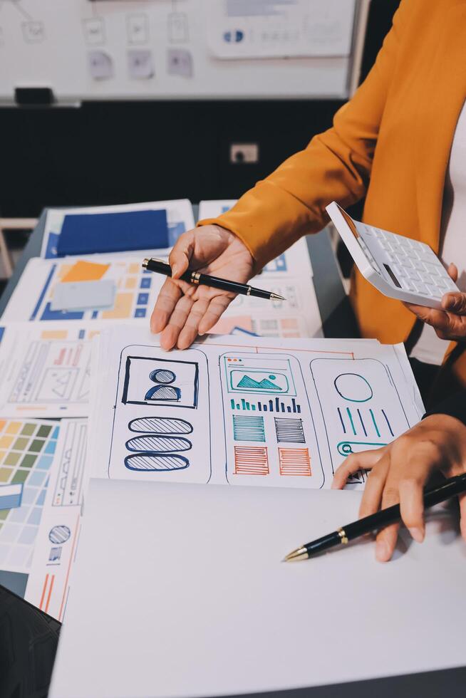 The designer team is designing the uxui system to make the uxui system work well on new phones and support system updates. Website development concept UI UX front end designer photo