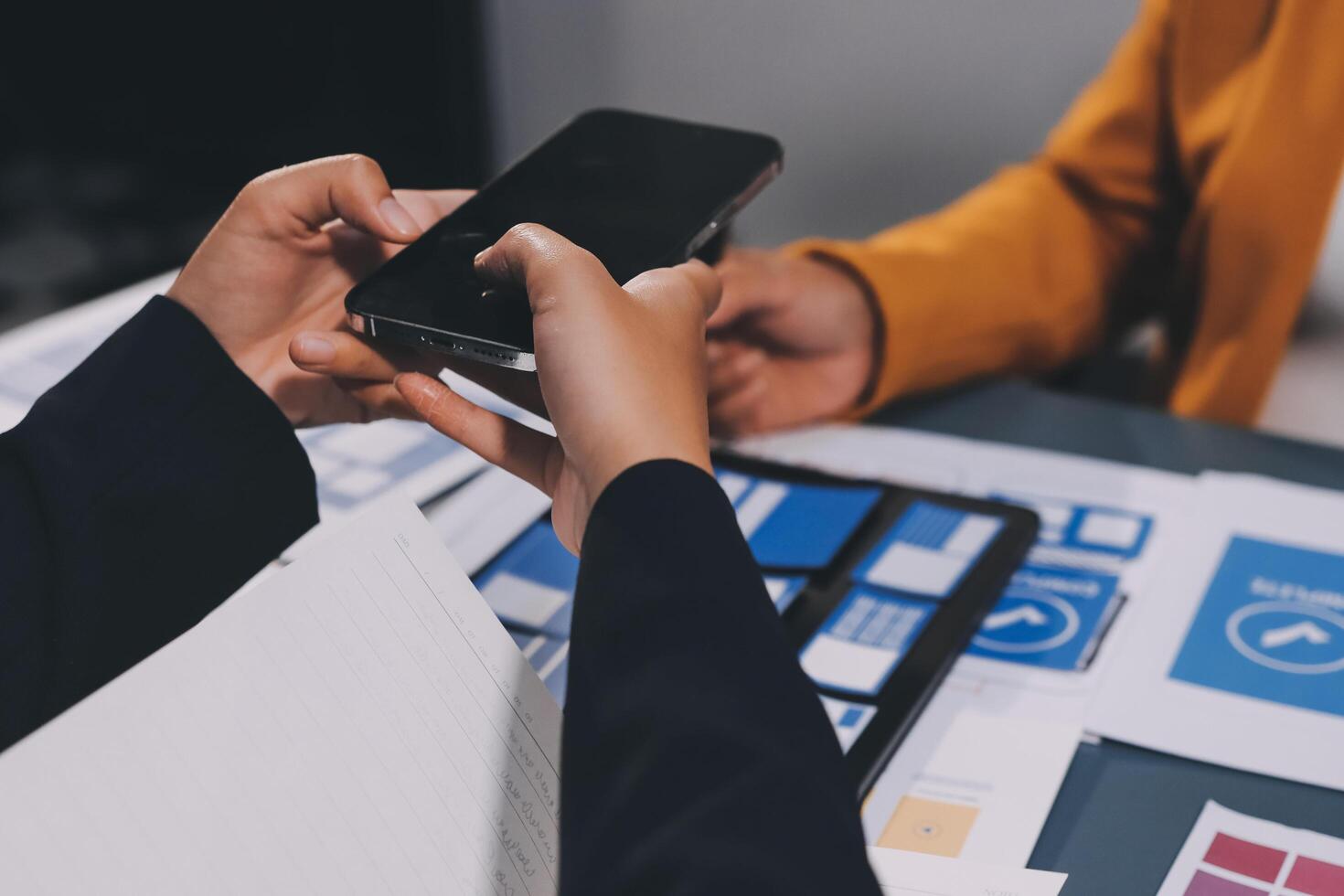 The designer team is designing the uxui system to make the uxui system work well on new phones and support system updates. Website development concept UI UX front end designer photo