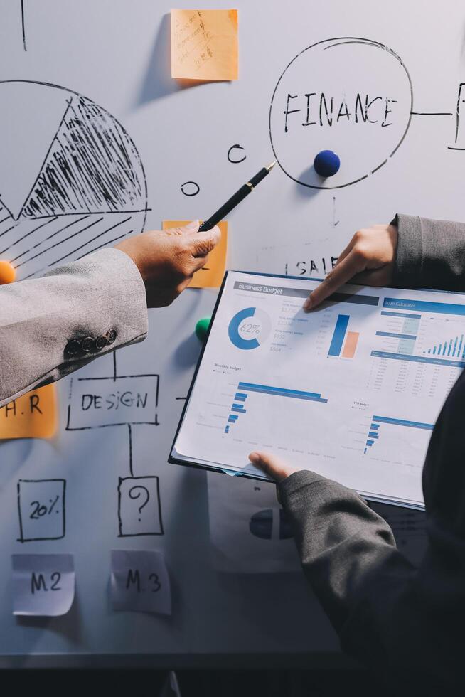 Business people are analyzing and planning business strategies. photo
